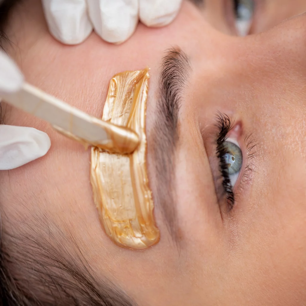 Eyebrow waxing treatment close-up at Etica Clinic London