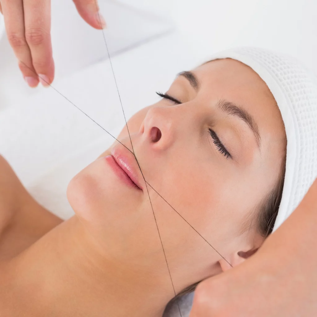 Upper lip threading treatment on woman at Etica Beauty Clinic