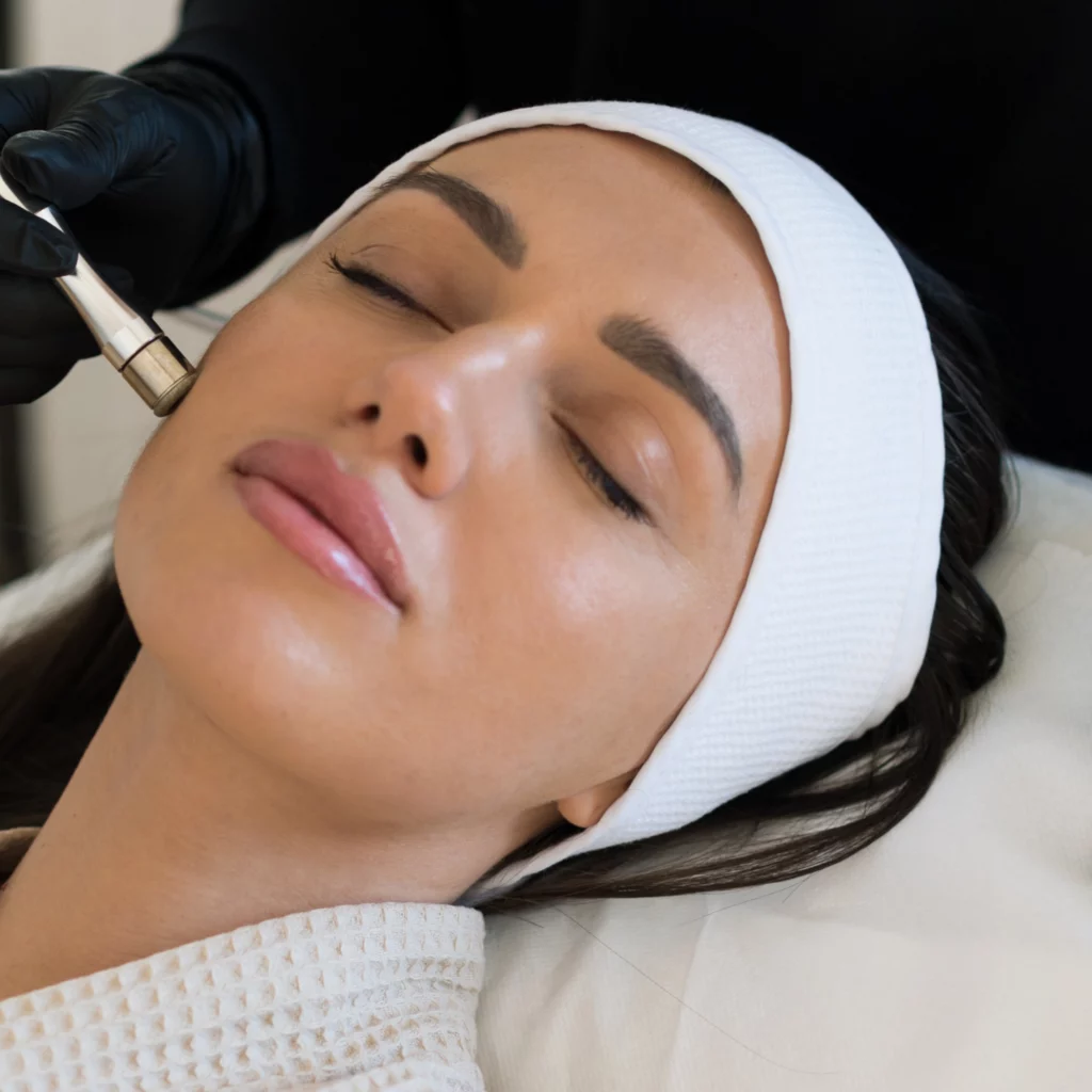 Woman receiving a professional microdermabrasion facial treatment at Etica Clinic London